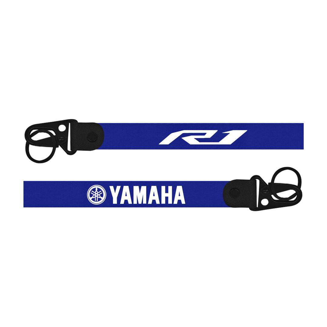 Two Yamaha R1 keychains with 'RJ' and Yamaha logos on a white background