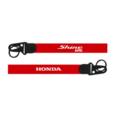 Red lanyard with 'Honda' and 'Shine 125' branding on a white background