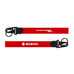 Two red straps with Suzuki and V-Strom SX branding on a white background