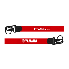 Two red straps with 'FZS' and 'Yamaha' logos on a white background