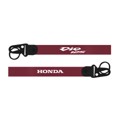 Maroon lanyard with 'Dio 125' and 'Honda' branding on a white background
