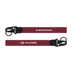 Maroon lanyard with black clip featuring 'Verna' and 'Hyundai' logos on a white background
