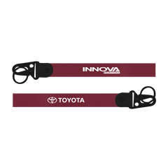 Two red lanyards with black ends featuring Innova and Toyota logos on a white background.