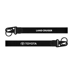 Black lanyard with 'Toyota Land Cruiser' text on a white background