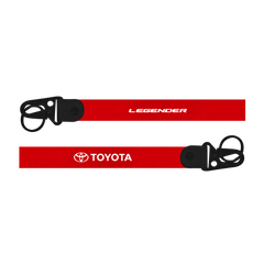 Red lanyard with 'Legender' and 'Toyota' logos on a white background