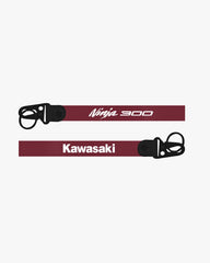 Two motorcycle seatbelts with 'Ninja 300' and 'Kawasaki' branding on a white background.