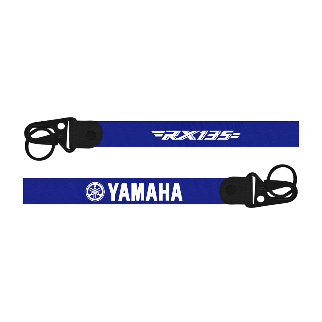 Two blue straps with 'Yamaha' and 'FX135' branding on a white background