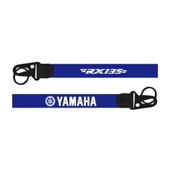 Two blue straps with 'Yamaha' and 'FX135' branding on a white background
