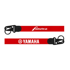 Two red straps with black buckles featuring 'Fasano' and 'Yamaha' logos on a white background.