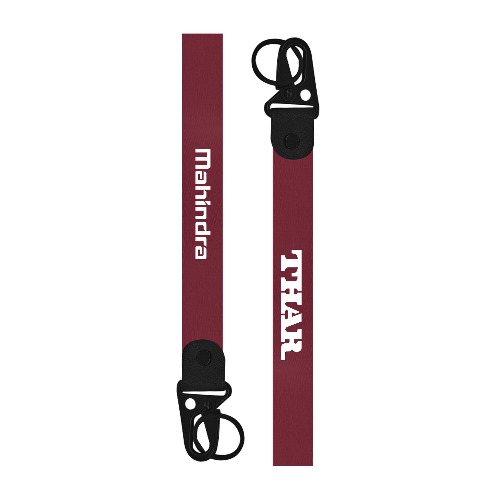 Two keychains with 'THAR' and 'Mahindra' branding on a white background