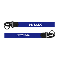 Two blue lanyards with 'HILUX' and 'TOYOTA' branding on a white Car keychain for Toyota Hilux custom fabric lanyard keychain with metal hookbackground