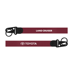 Red dog leash with 'Toyota Land Cruiser' branding on a white background