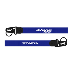 Two blue lanyards with 'Shine 100' and 'Honda' branding on a white background.