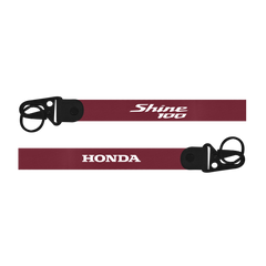 Maroon lanyard with 'Shine 100' and 'Honda' branding on a white background