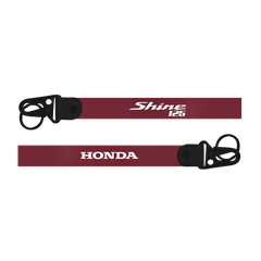 Maroon lanyard with 'Shine 125' and 'Honda' branding on a white background