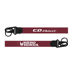 Hero Honda CD Deluxe Keychain red Two maroon lanyards with black ends featuring 'CD Deluxe' and 'Hero Honda' logos on a white background.