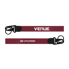 Red lanyard with 'Venue' and Hyundai logos on a white background