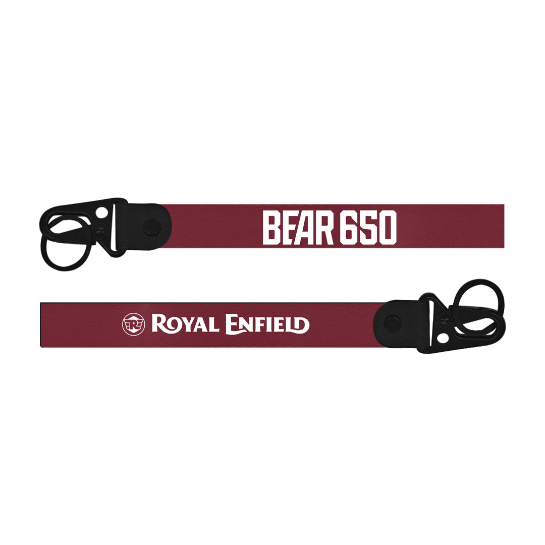 Two maroon Royal Enfield Bear 650 bike Keychain straps with black buckles and text on a white background