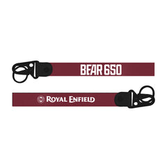 Two maroon Royal Enfield Bear 650 bike Keychain straps with black buckles and text on a white background