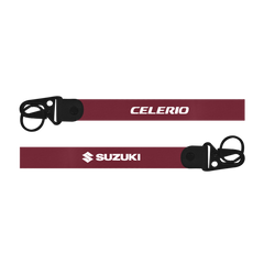 Two maroon lanyards with 'Celerio' and 'Suzuki' branding on a white background