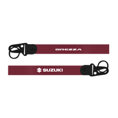 Two maroon straps with 'Brezza' and 'Suzuki' branding on a white background