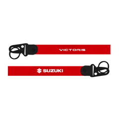 Two red lanyards with 'Victoris' and 'Suzuki' branding on a white background