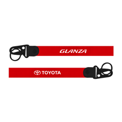 Red lanyard with 'Glanza' and 'Toyota' logos on a white background