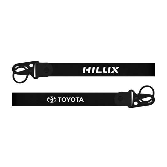 Two black lanyards with 'HILUX' and 'TOYOTA' branding on a white background.