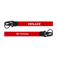 Red lanyard with 'HILUX' and 'TOYOTA' logos on a white background