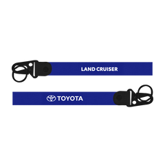 Two blue lanyards with 'Land Cruiser' and 'Toyota' branding on a white background