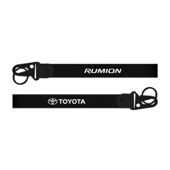 Two black straps with 'Rumion' and 'Toyota' logos on a white background