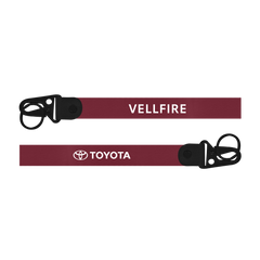 Maroon lanyard with 'Vellfire' and 'Toyota' branding on a white background