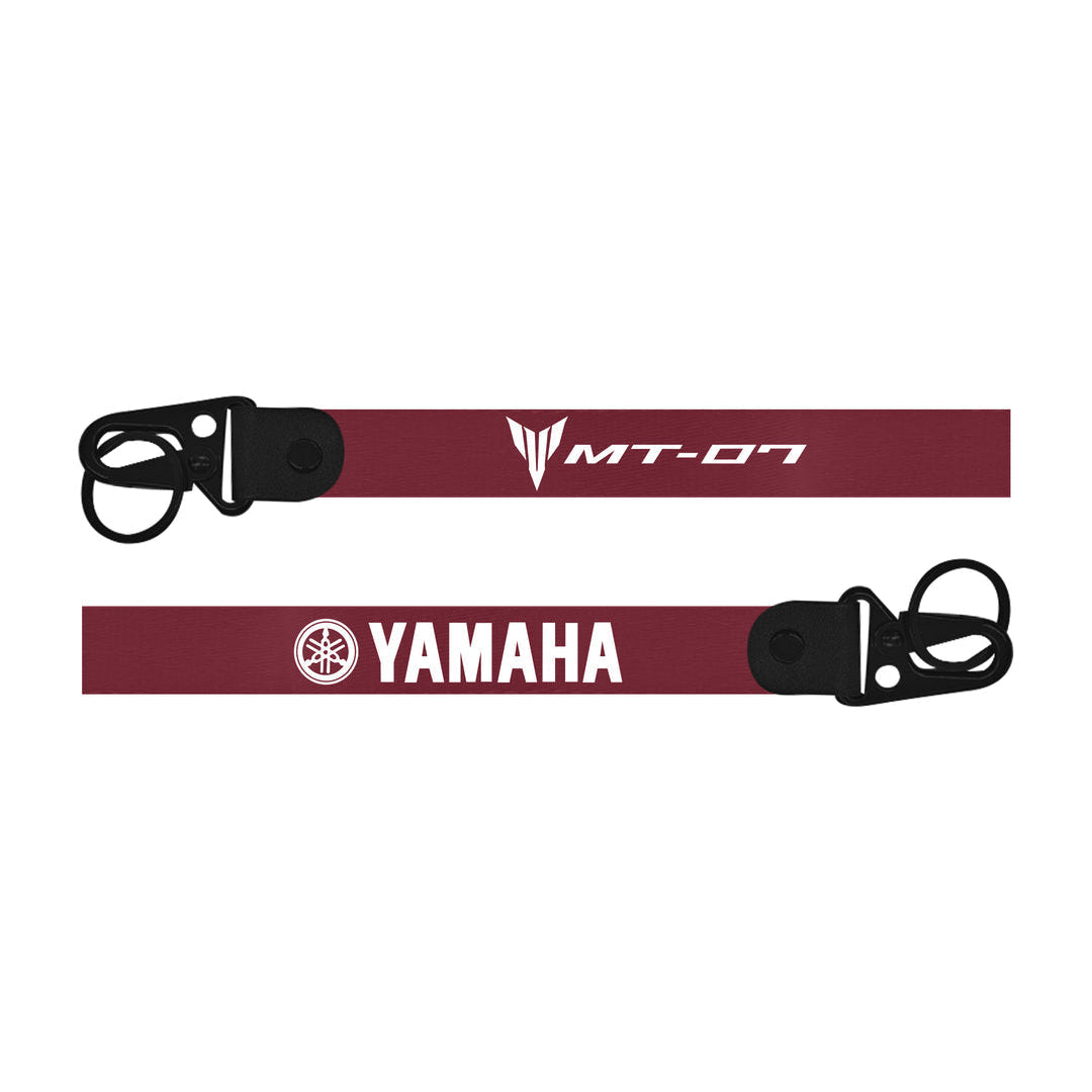 Two red bike keychain  straps with black buckles and Yamaha branding on a white background