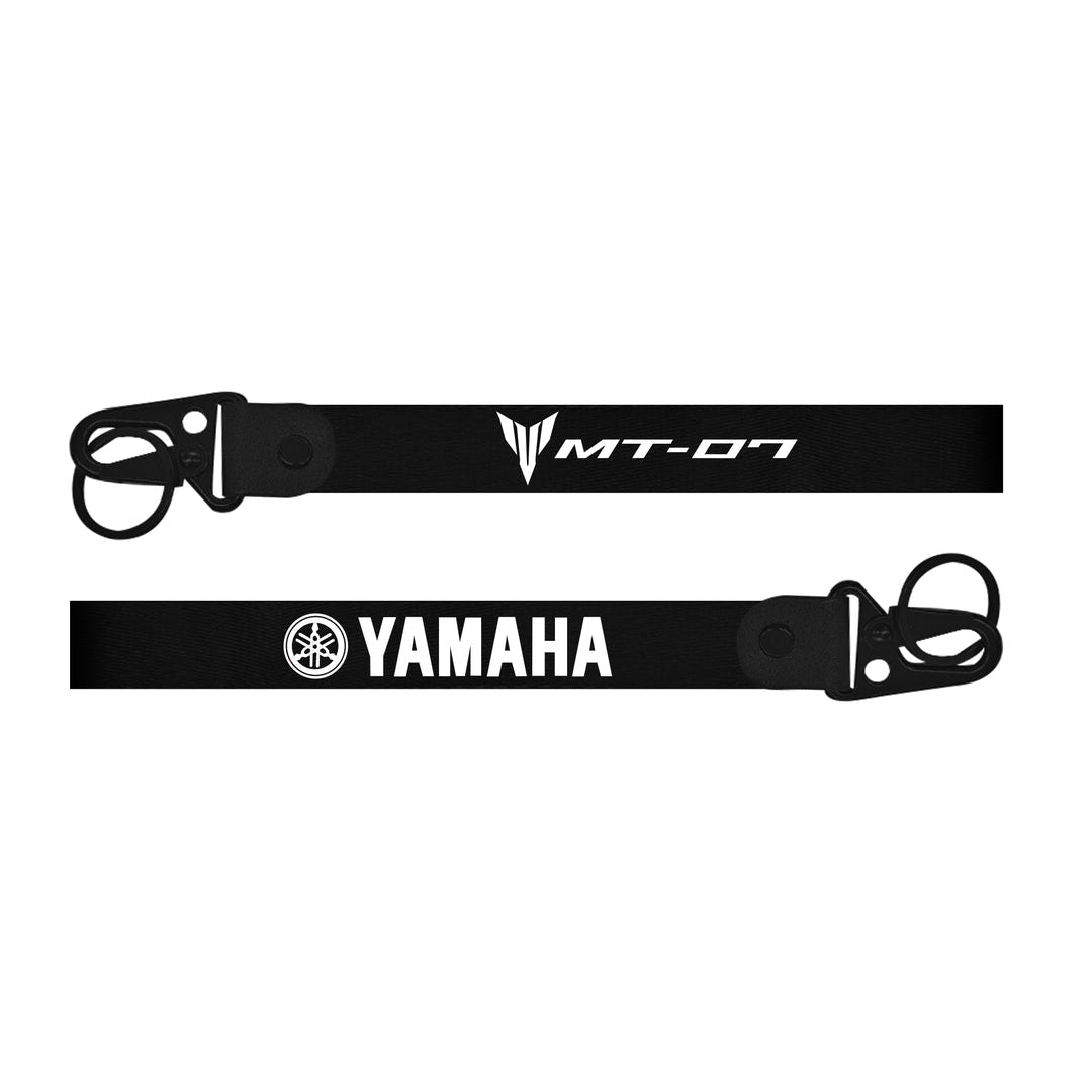Black bike keychain with Yamaha logo on a white background