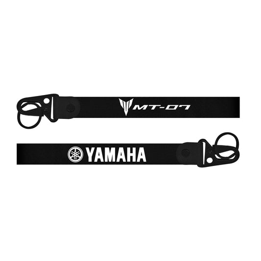 Black bike keychain with Yamaha logo on a white background