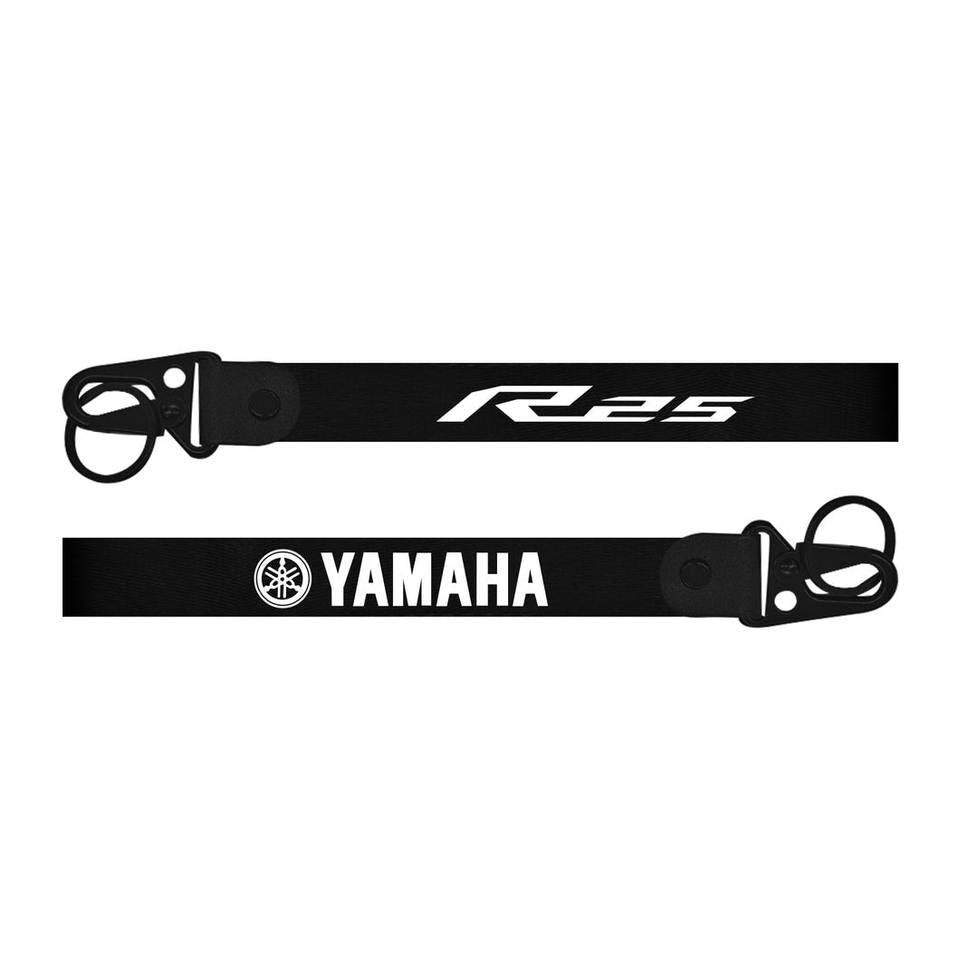 Black bike keychain with Yamaha logo on a white background