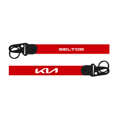 Red lanyards with 'Seltos' and 'Kia' logos on a white background