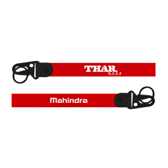 Two red straps with 'THAR' and 'Mahindra' branding on a white background