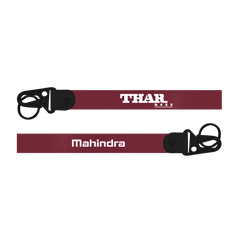 Maroon lanyard with 'THAR' and 'Mahindra' branding on a white background
