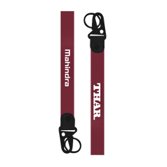 Two keychains with 'THAR' and 'Mahindra' branding on a white background
