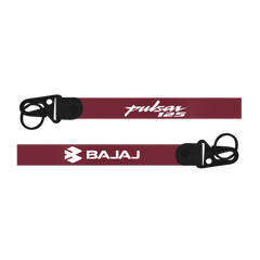 Maroon motorcycle exhaust with 'Pulsar 125' and 'Bajaj' branding on a white background