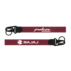 Maroon helmet strap with 'Pulsar 220F' and 'Bajaj' branding on a white background