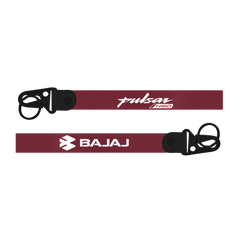 Two motorcycle seatbelts with 'Pulsar' and 'Bajaj' branding on a white background